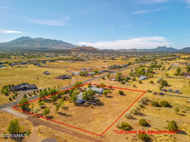 an aerial view of residential building with ocean view