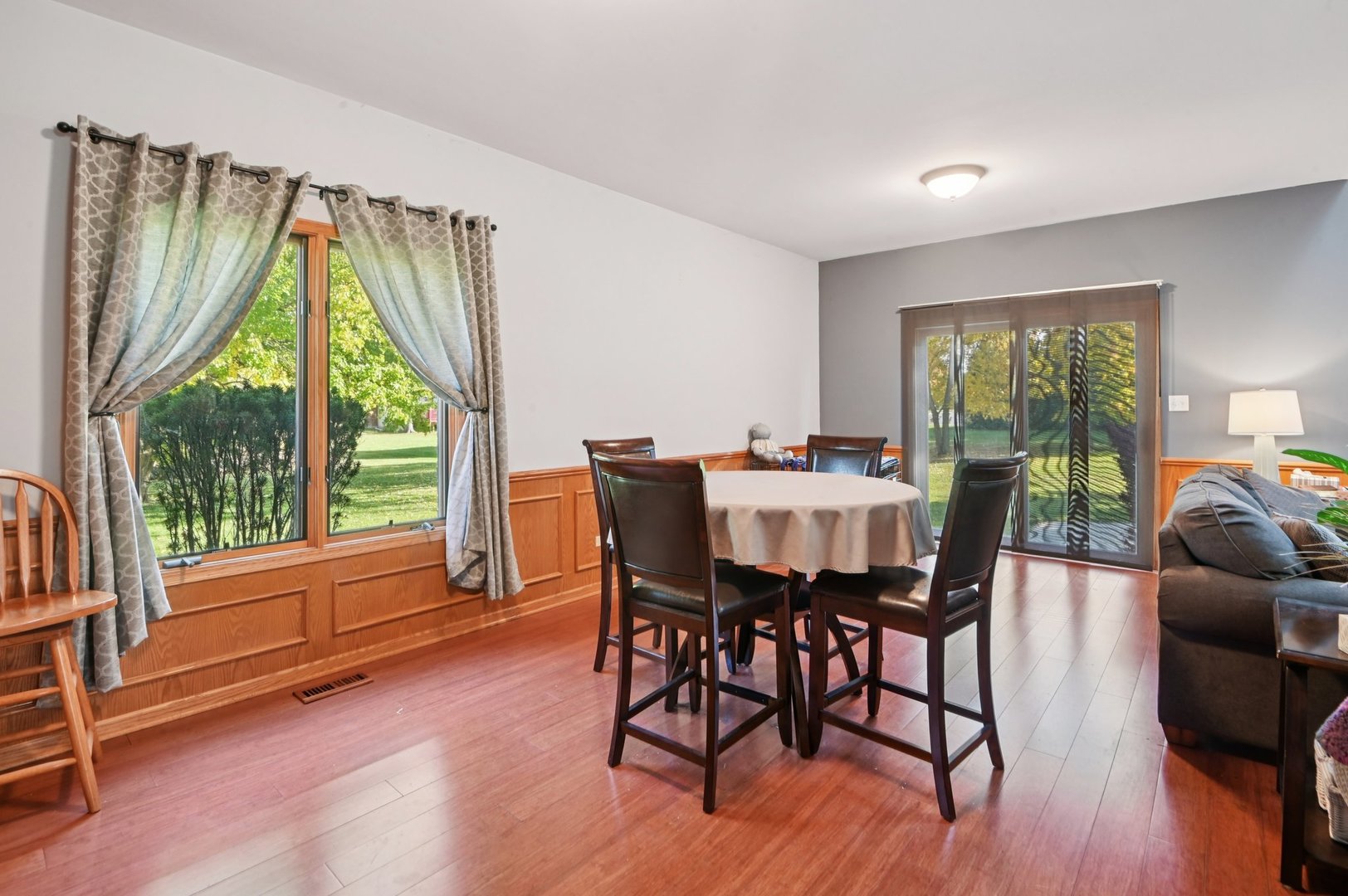 1575 Benton Street Crete, IL 60417 - Photo 12 of 66 a view of a dining room with furniture window and wooden floor
