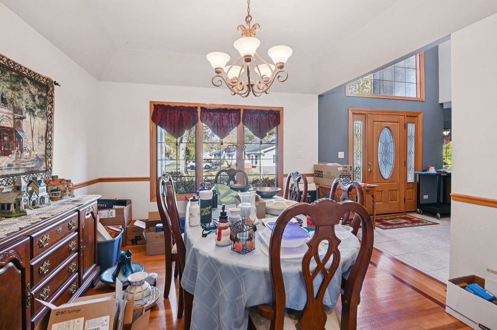 1575 Benton Street Crete, IL 60417 - Photo 19 of 66 a view of a dining room with furniture a chandelier and wooden floor