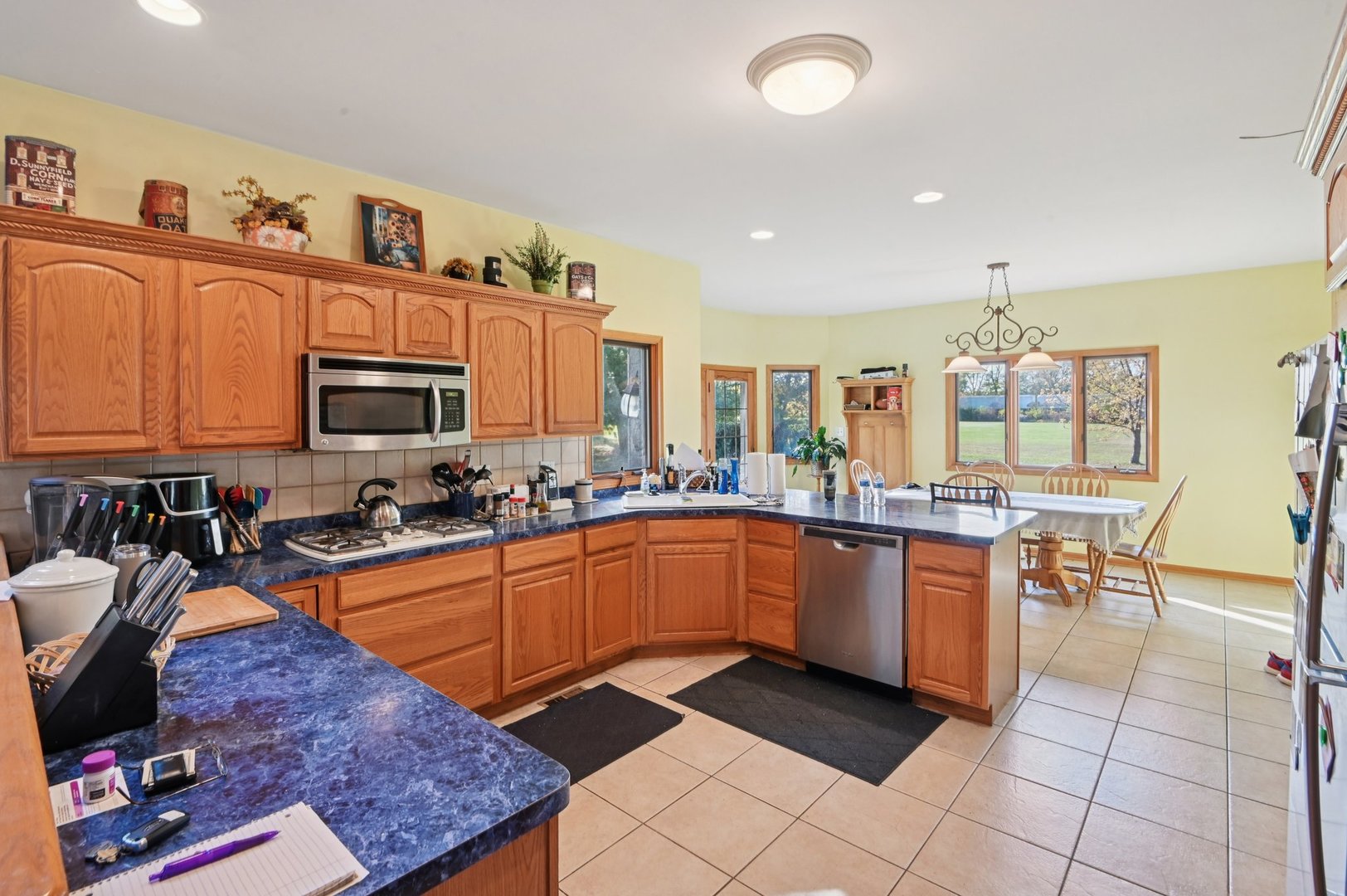 1575 Benton Street Crete, IL 60417 - Photo 20 of 66 a open kitchen with stainless steel appliances granite countertop a sink dishwasher stove and cabinets