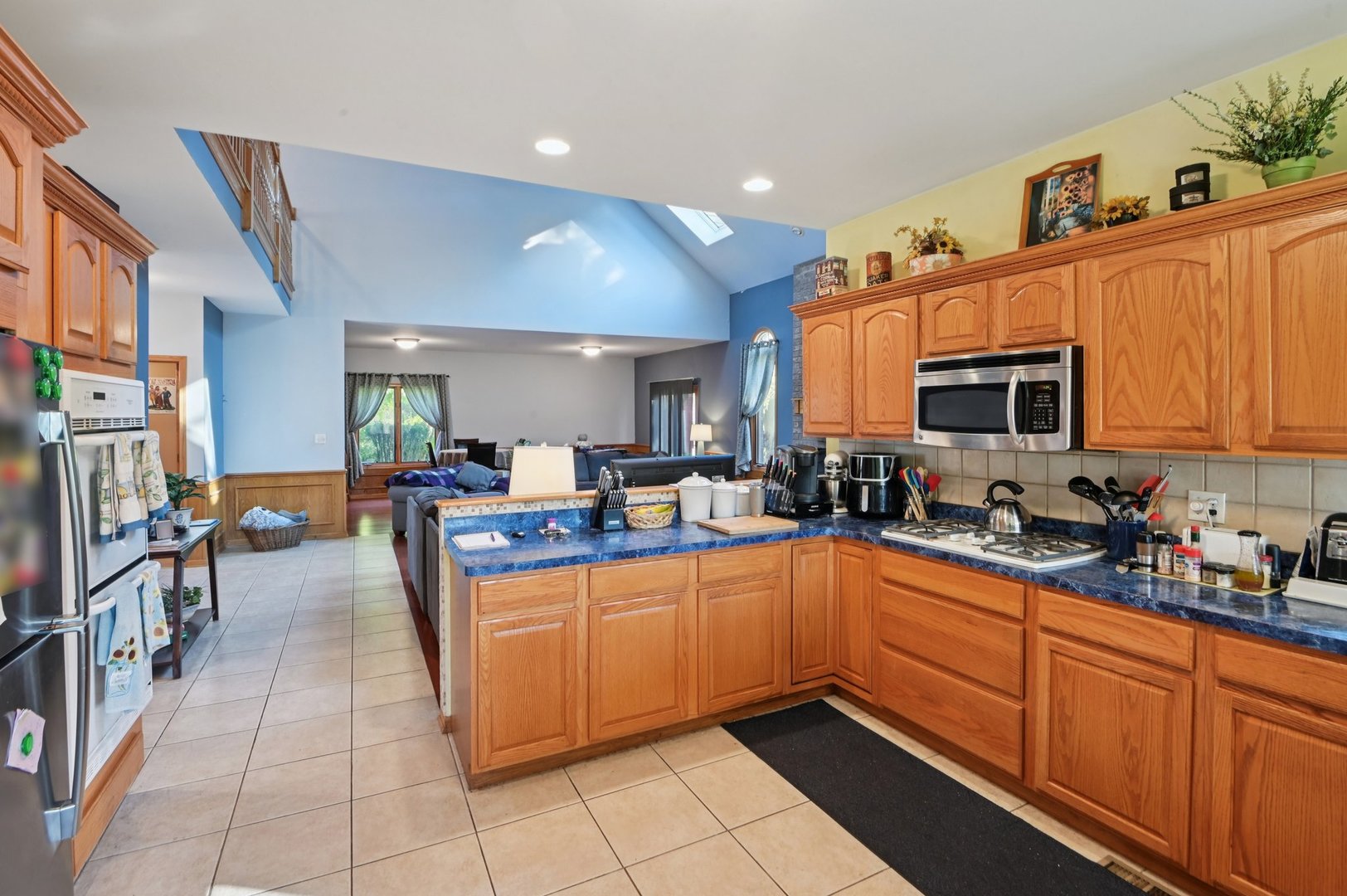 1575 Benton Street Crete, IL 60417 - Photo 22 of 66 a kitchen with stainless steel appliances a sink counter space cabinets and a couch