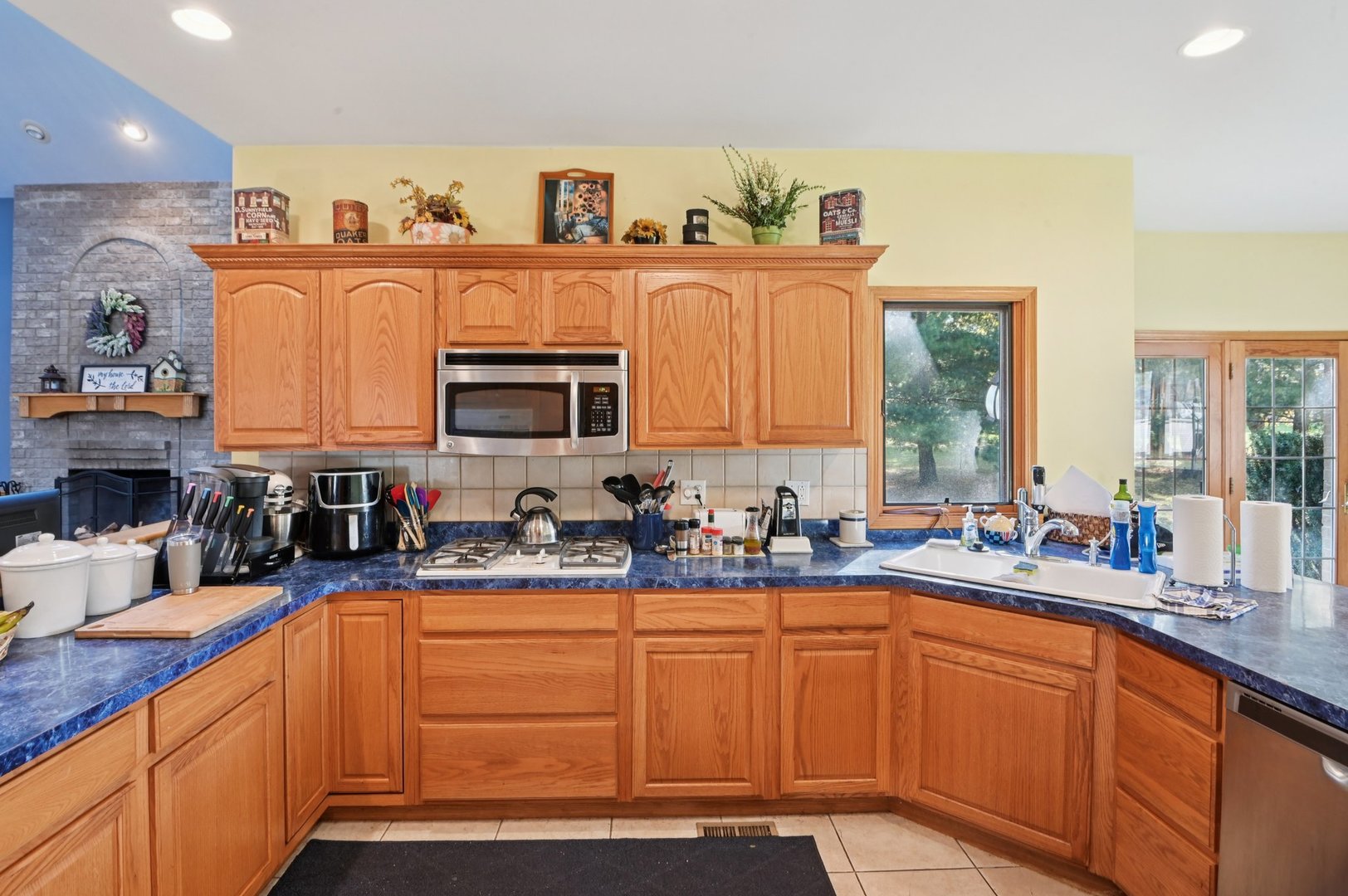 1575 Benton Street Crete, IL 60417 - Photo 23 of 66 a kitchen with stainless steel appliances granite countertop a sink stove and cabinets