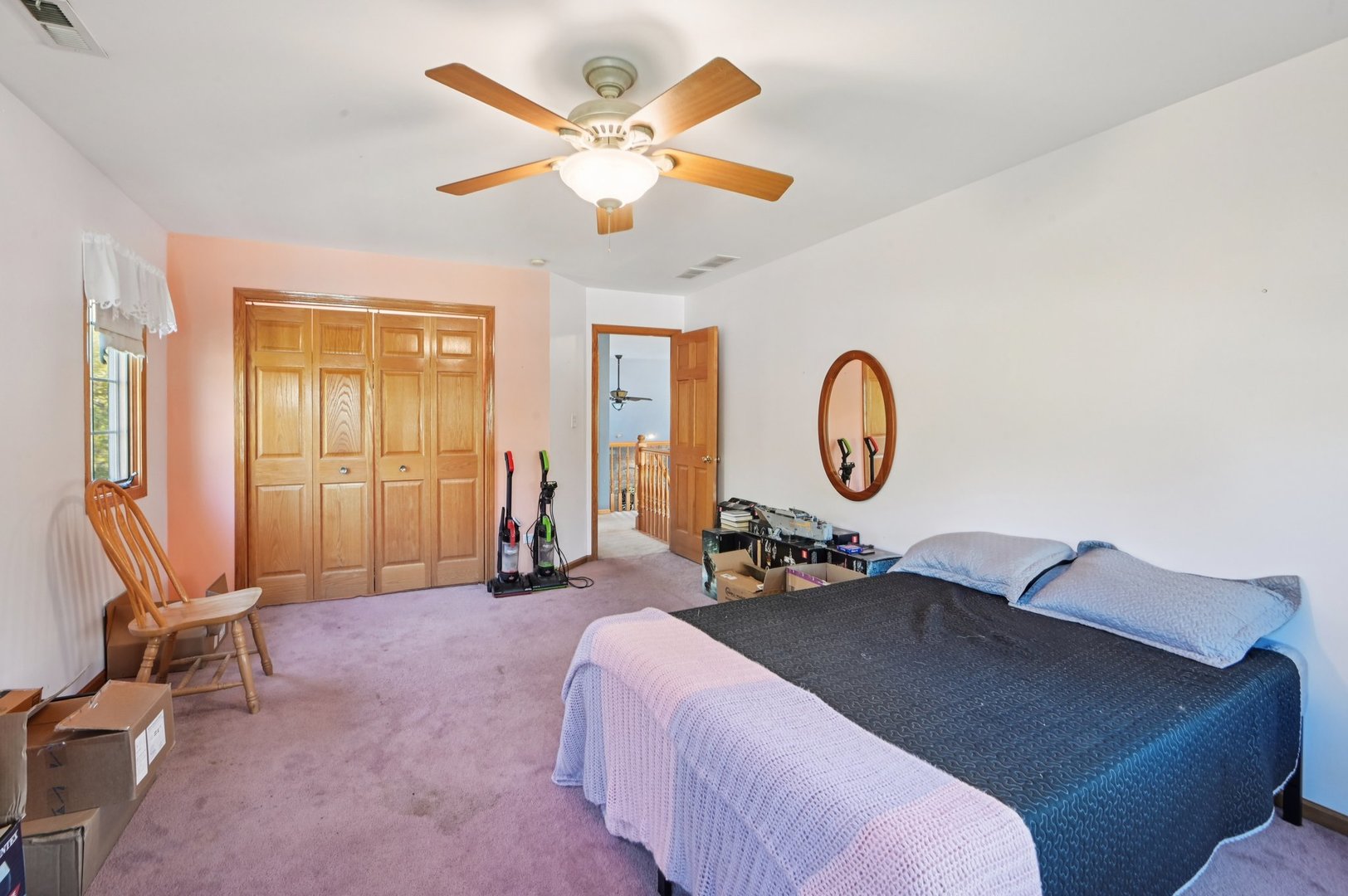 1575 Benton Street Crete, IL 60417 - Photo 29 of 66 a bed room with a bed and a chandelier