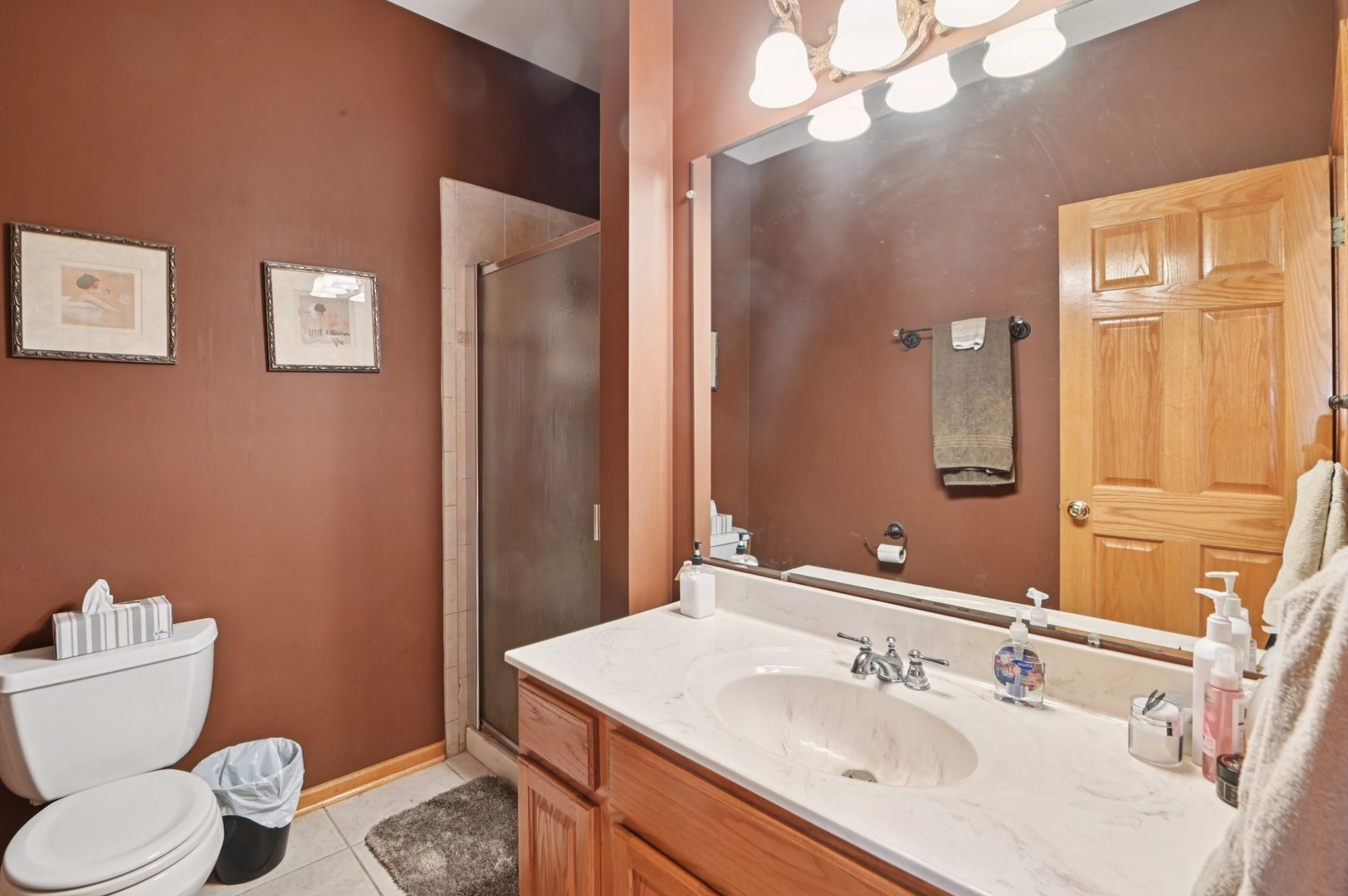 1575 Benton Street Crete, IL 60417 - Photo 31 of 66 a bathroom with a sink vanity mirror and toilet
