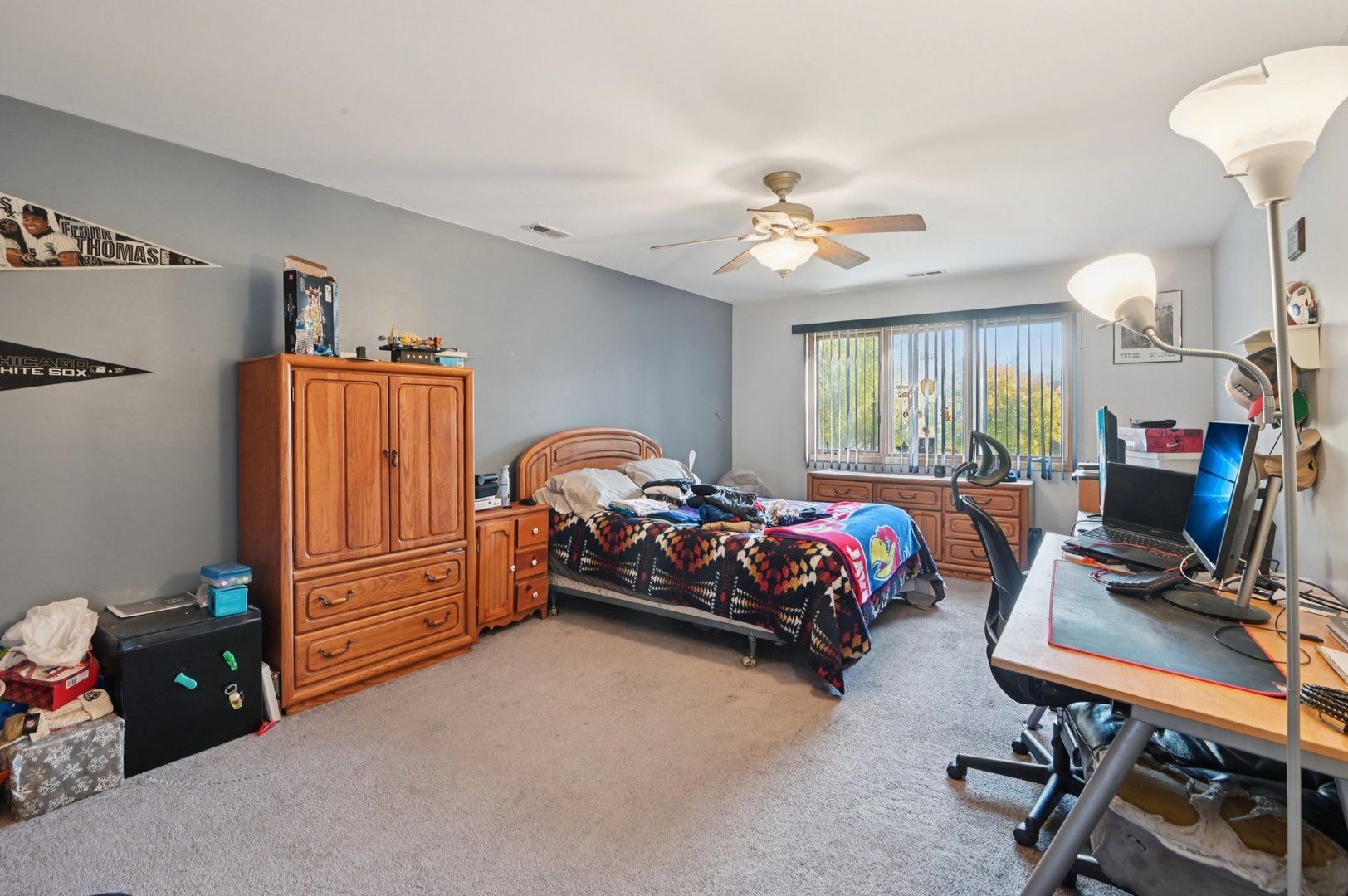 1575 Benton Street Crete, IL 60417 - Photo 34 of 66 a bedroom with a bed and a chandelier