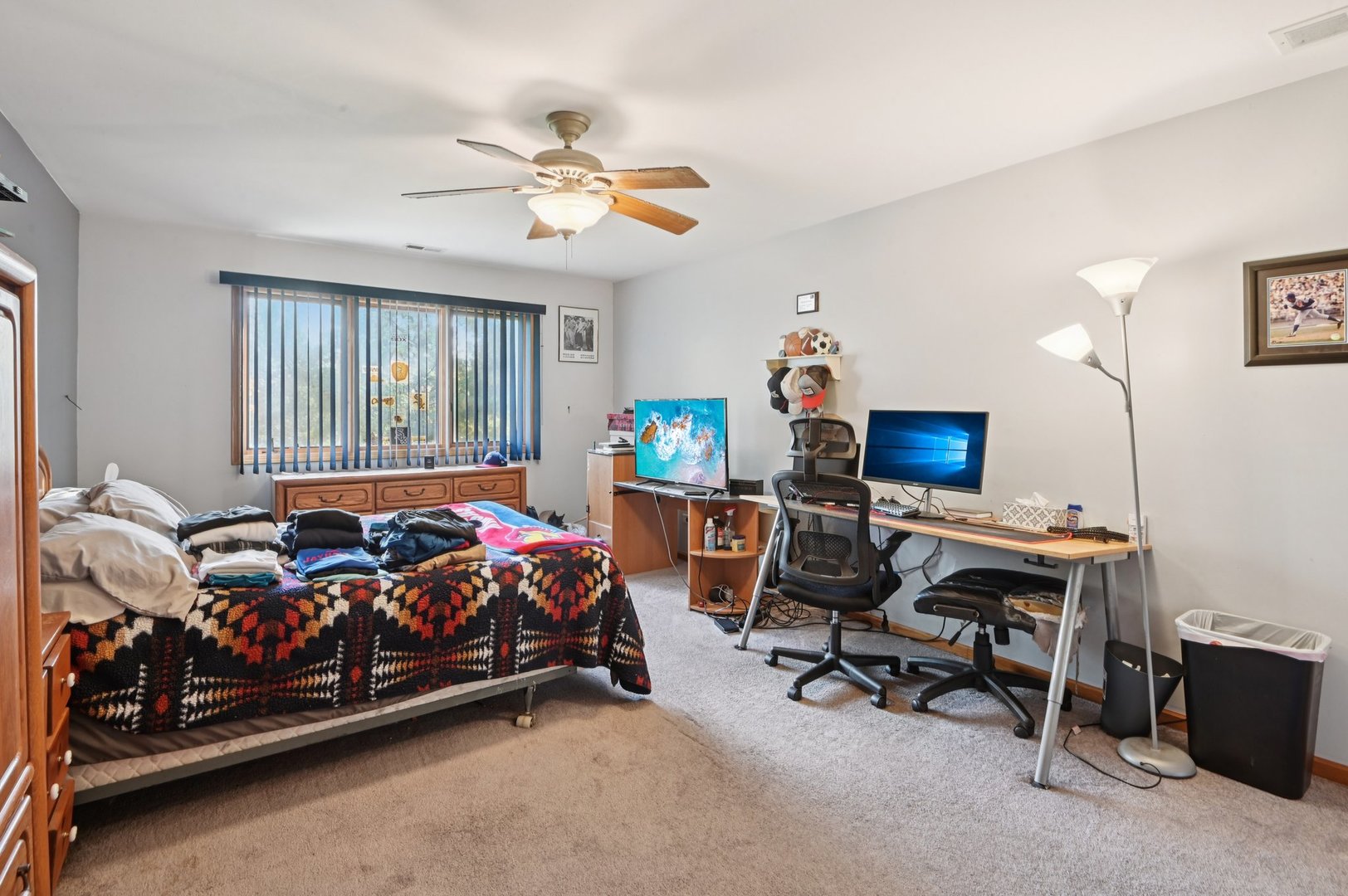 1575 Benton Street Crete, IL 60417 - Photo 35 of 66 a bedroom with a bed and a chandelier