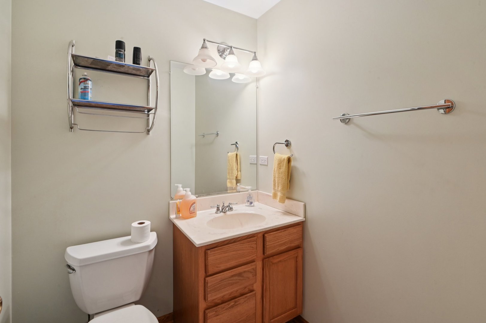 1575 Benton Street Crete, IL 60417 - Photo 38 of 66 a bathroom with a toilet sink and mirror