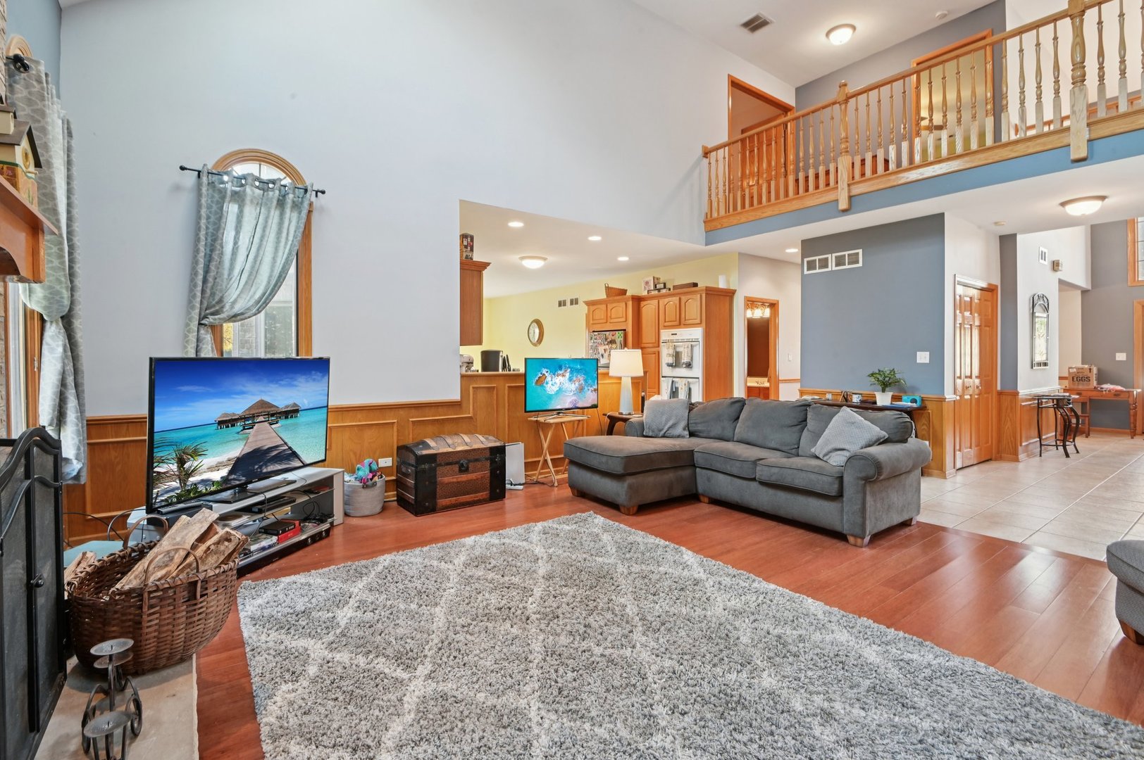 1575 Benton Street Crete, IL 60417 - Photo 9 of 66 a living room with furniture a flat screen tv and a fireplace