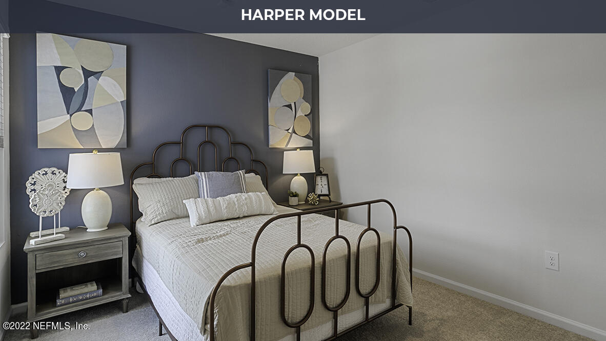 77 Java Lane St. Augustine, FL 32092 - Photo 11 of 31 a bedroom with a bed and a painting on the wall