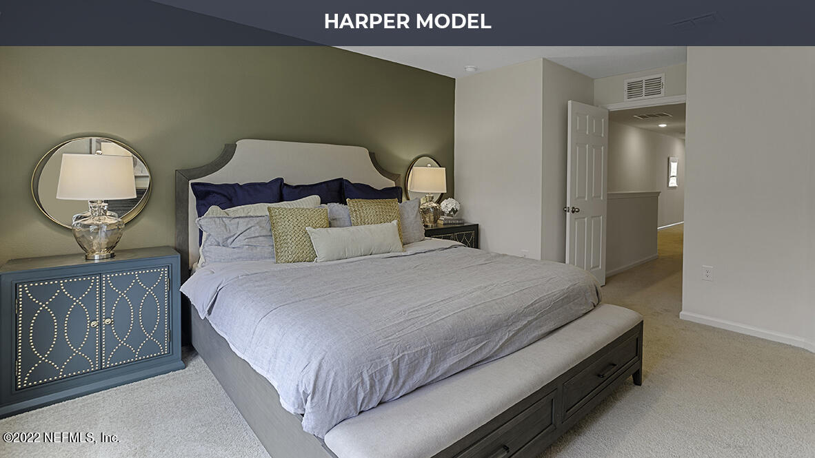 77 Java Lane St. Augustine, FL 32092 - Photo 9 of 31 a bedroom with a bed and a painting on the wall