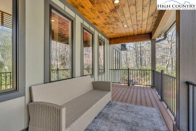 a view of balcony with wooden floor