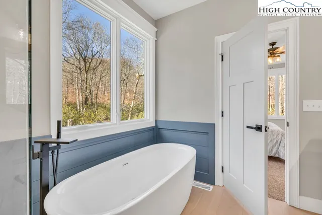 a bathroom with a bathtub and a shower