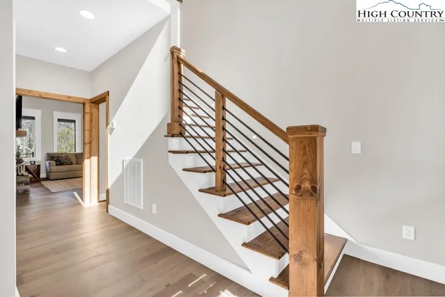 a view of an entryway with wooden floor