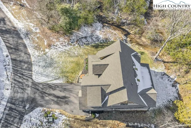 a front view of a house with a yard and balcony