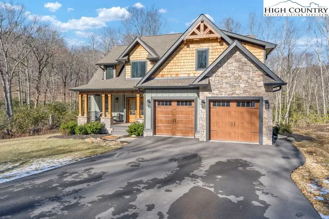a front view of a house with a garden and patio