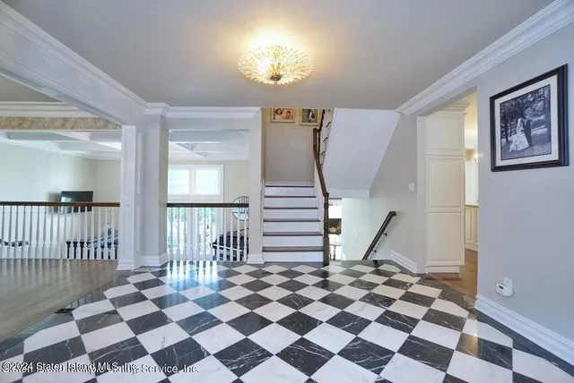 a view of a livingroom with a black and white checkered floor
