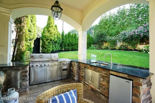 a open kitchen with a sink and large window
