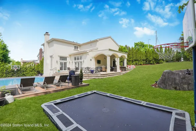 a view of a house with a yard porch and sitting area