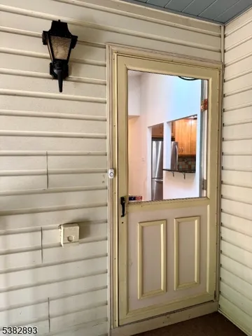 a view of front door and bedroom