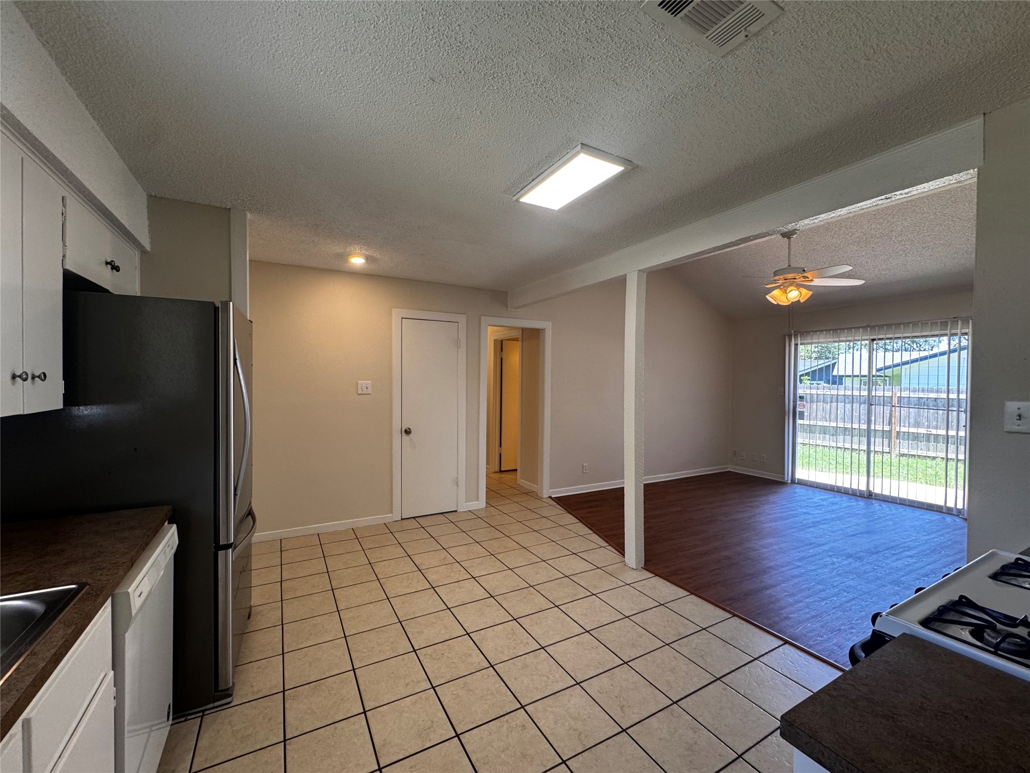 5916 A Cherry Loop Austin, TX 78745 - Photo 12 of 12 A well-appointed kitchen flows seamlessly into an airy living area, offering a functional open floorplan.