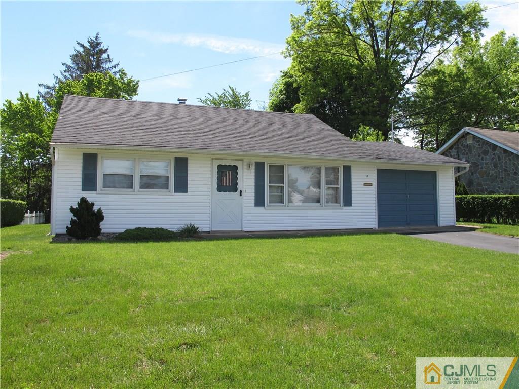 a view of a house with a backyard