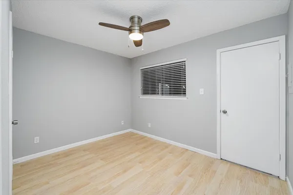 a living room with furniture a rug and a painting on the wall