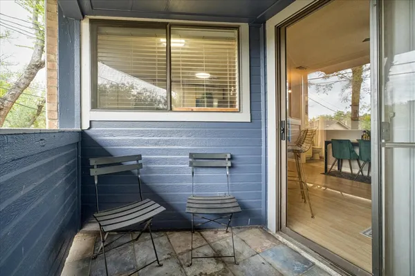 a view of a glass door and a living room