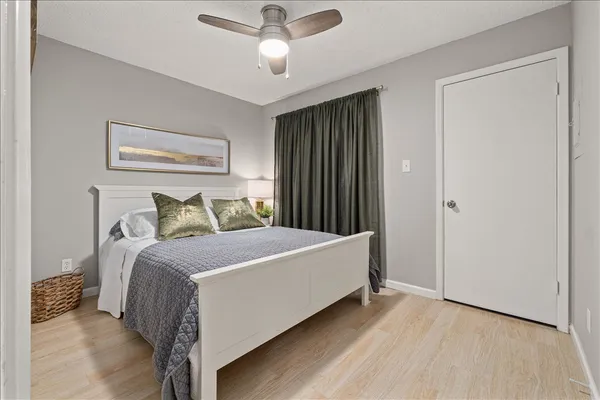 a bed room with a bed and a walk in closet