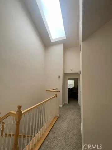 a view of a room with a hallway