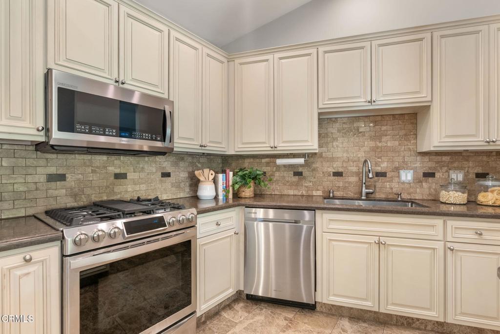 1544 La Loma Road Pasadena, CA 91105 - Photo 13 of 28 a kitchen with granite countertop white cabinets and stainless steel appliances