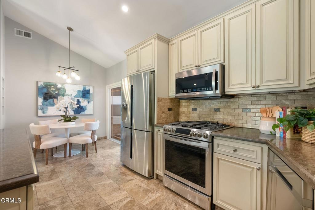 1544 La Loma Road Pasadena, CA 91105 - Photo 14 of 28 a kitchen with stainless steel appliances white cabinets and a stove top oven