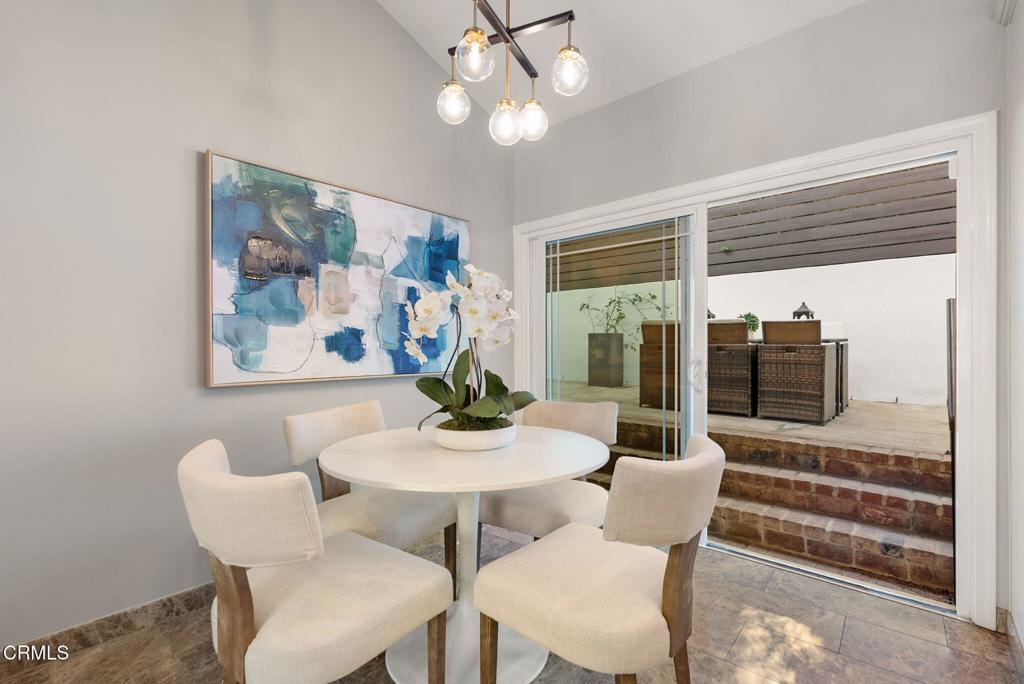 1544 La Loma Road Pasadena, CA 91105 - Photo 15 of 28 a view of a dining room with furniture large window and wooden floor