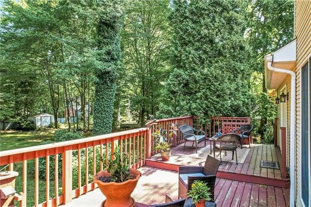 a view of a house with swimming pool and yard