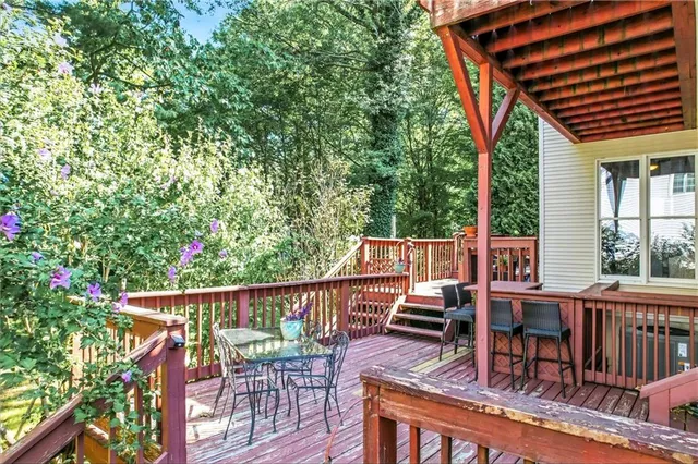 a swimming pool with outdoor seating and yard