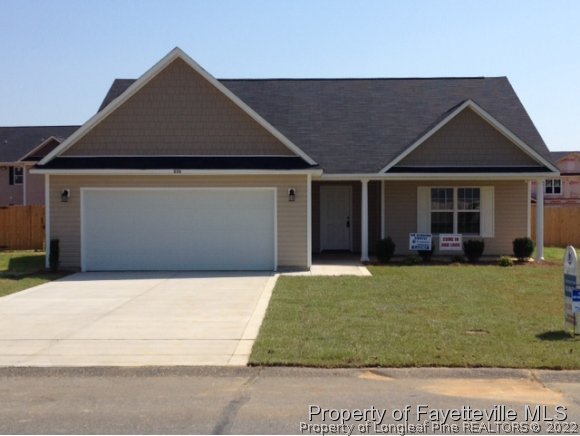 232 Decatur Drive Fayetteville, NC 28303 - Photo 1 of 25 a front view of a house with a yard