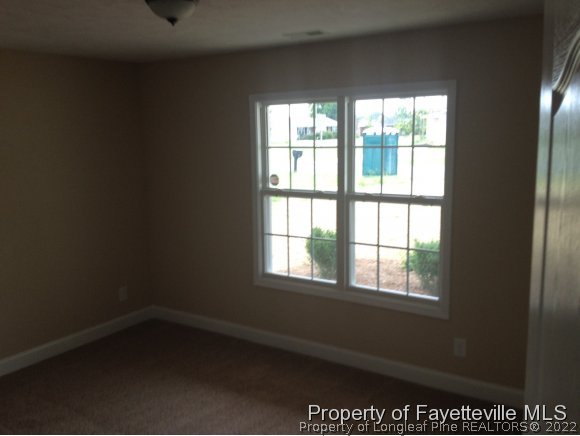 232 Decatur Drive Fayetteville, NC 28303 - Photo 12 of 25 an empty room with a window