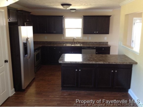 232 Decatur Drive Fayetteville, NC 28303 - Photo 5 of 25 a kitchen with a sink and cabinets