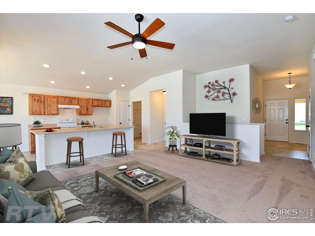 930 Milner Pass Road Severance, CO 80550 - Photo 4 of 37 a living room with furniture and a flat screen tv