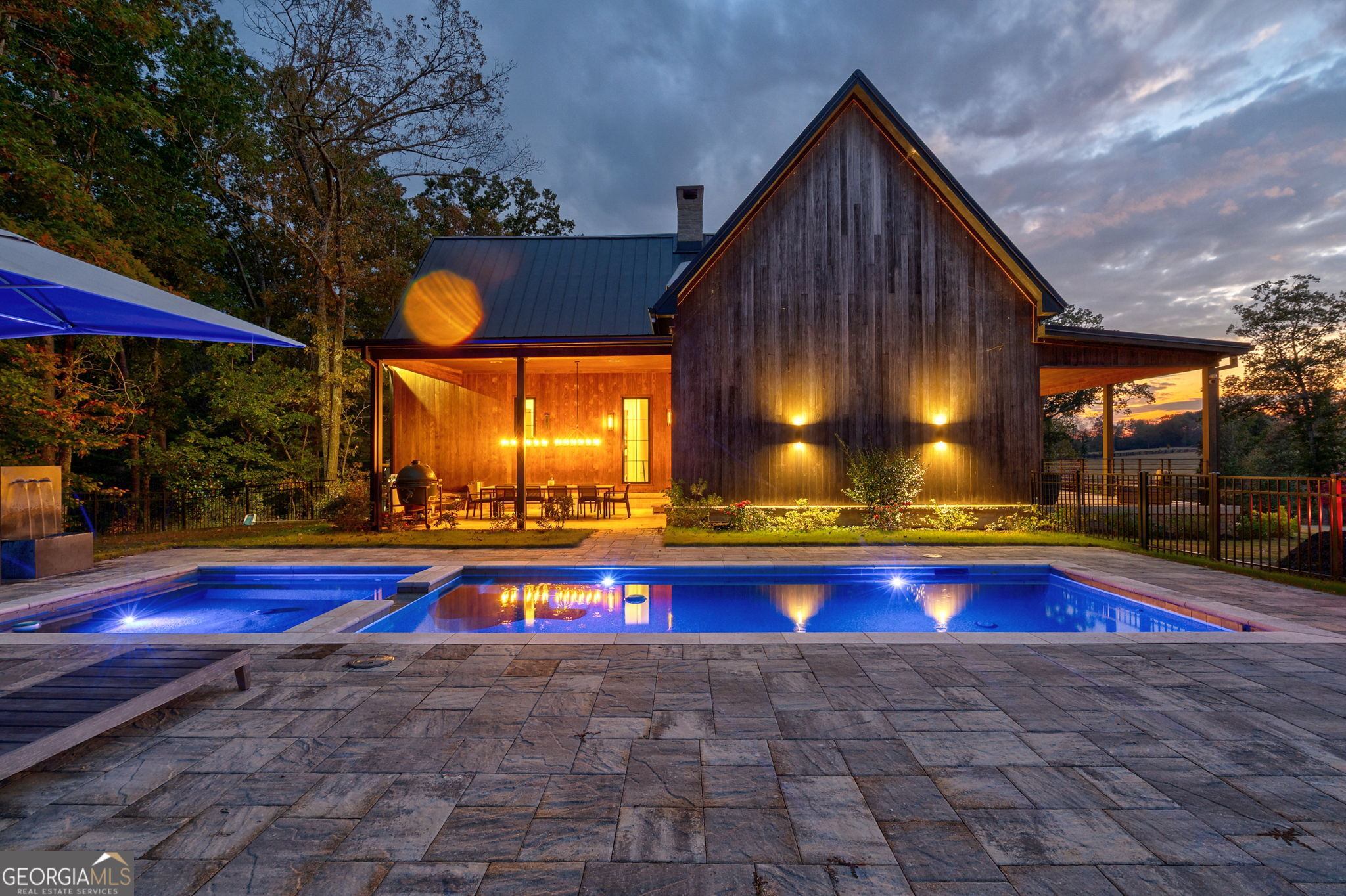a view of swimming pool with a patio and a yard