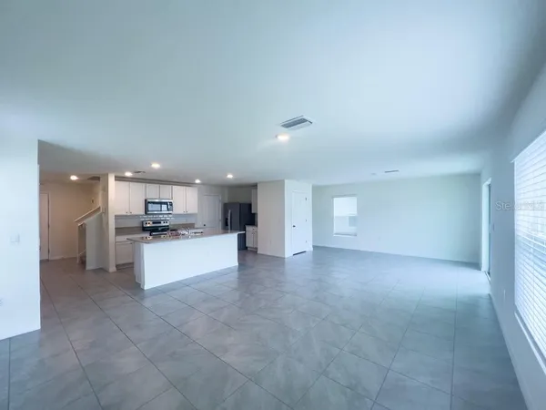 a view of a livingroom with a kitchen