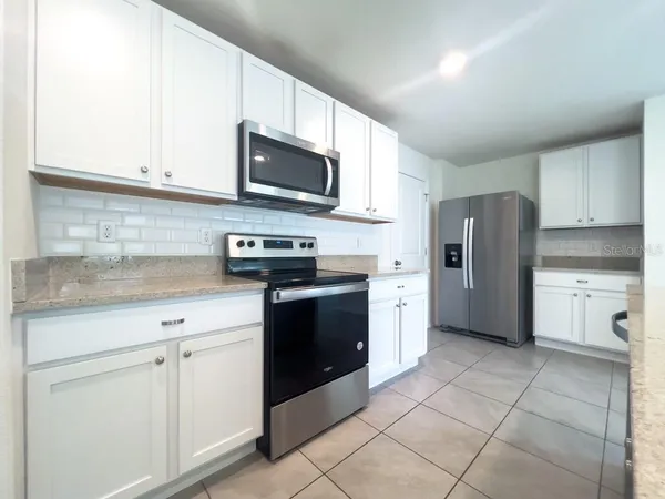 a kitchen with a stove and a sink