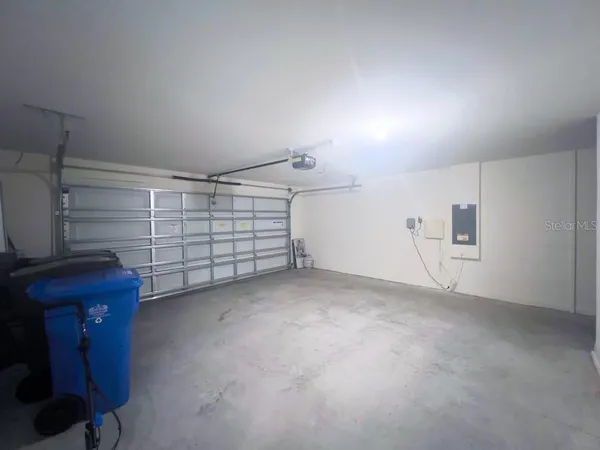 a bathroom with a sink mirror and toilet