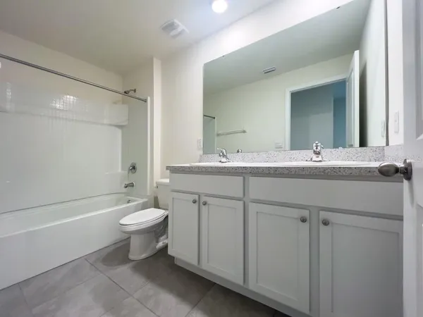 an empty room with a empty space and windows