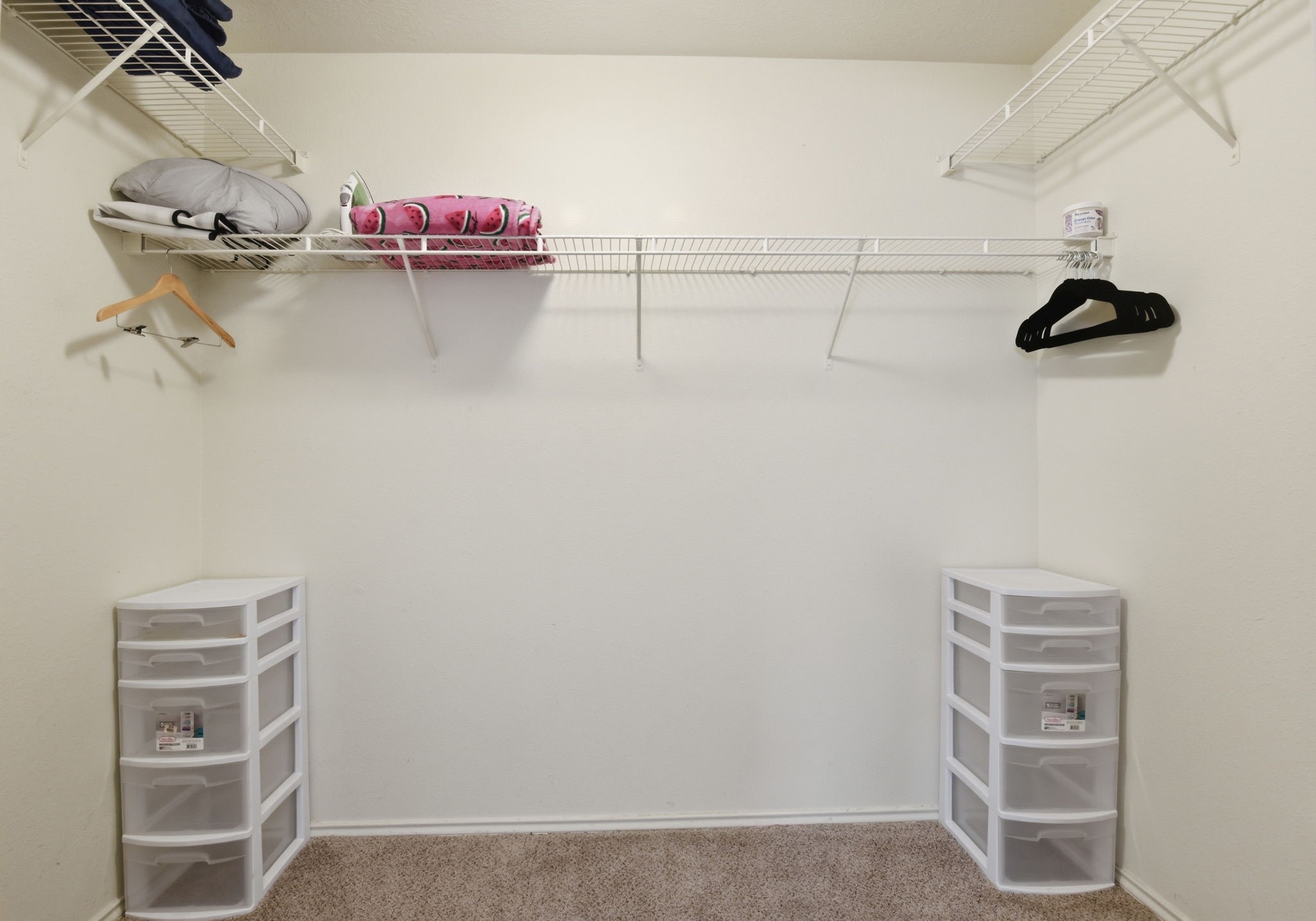 9519 Maple Green Lane Houston, TX 77044 - Photo 17 of 50 a view of a room with racks on the wall