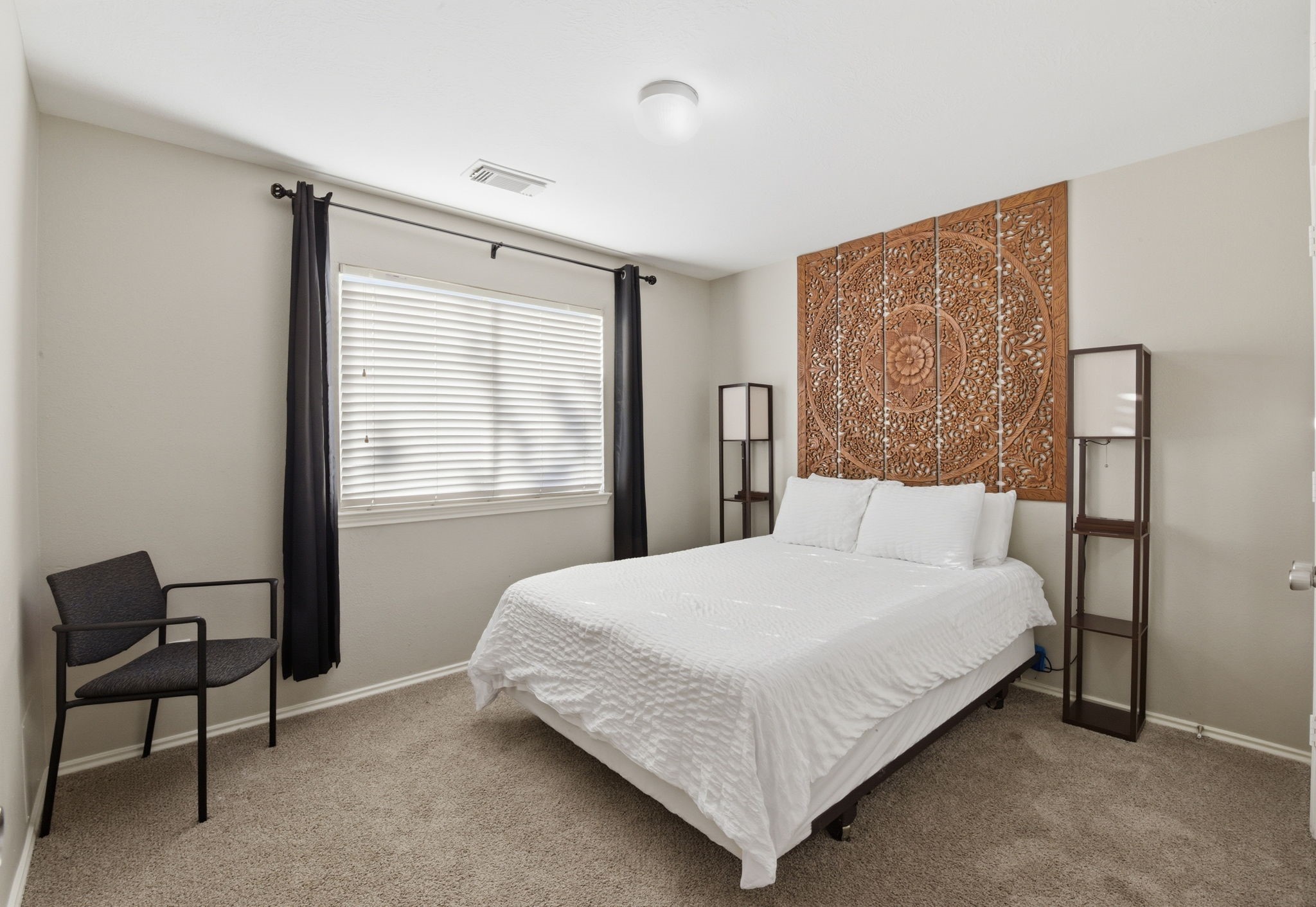 9519 Maple Green Lane Houston, TX 77044 - Photo 18 of 50 a bedroom with a bed and chair