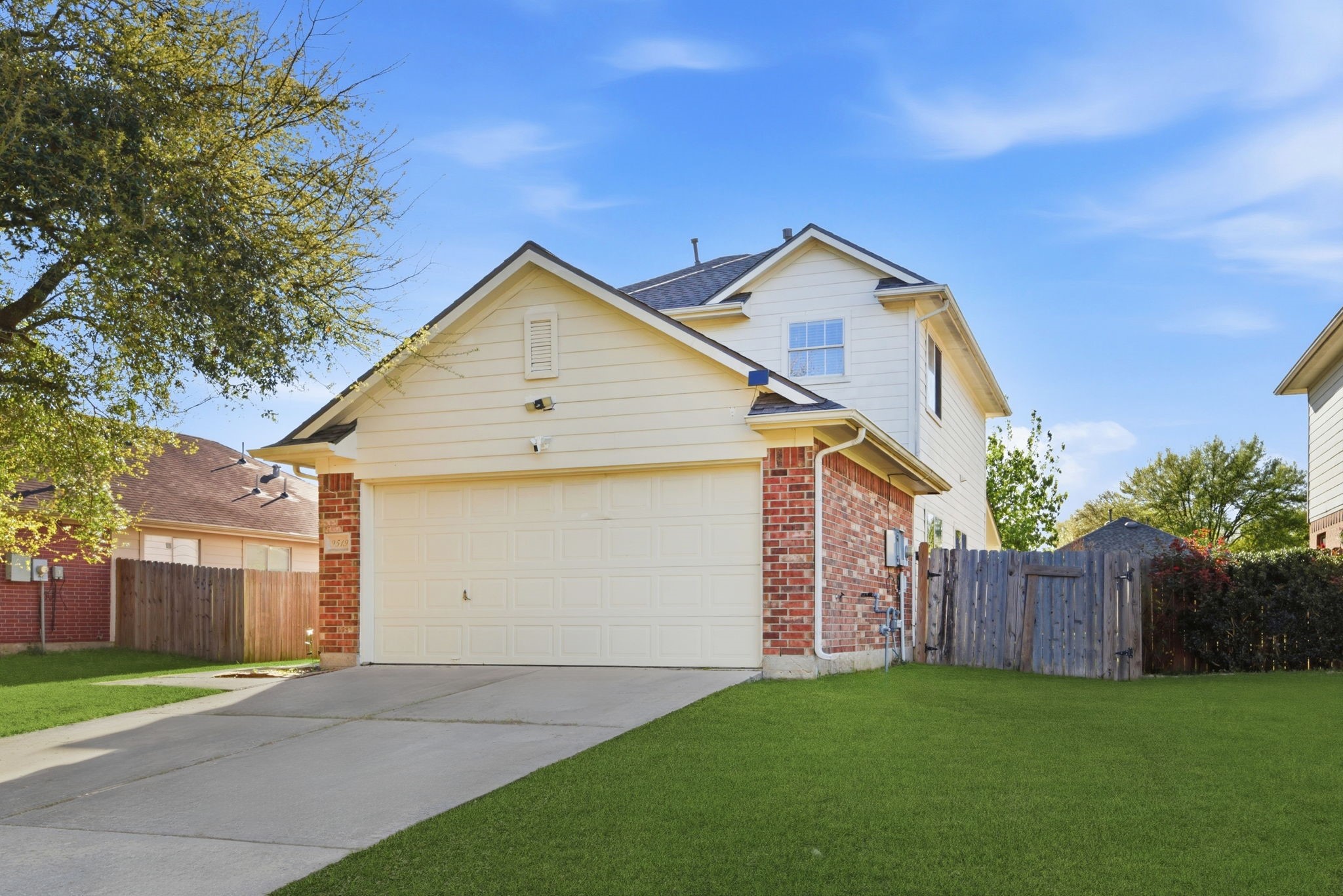 9519 Maple Green Lane Houston, TX 77044 - Photo 2 of 50 a view of a small house with wooden fence