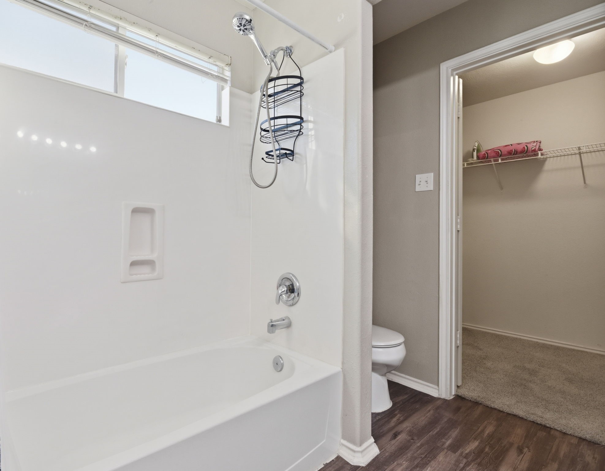 9519 Maple Green Lane Houston, TX 77044 - Photo 24 of 50 a bathroom with a bathtub a toilet and a shower