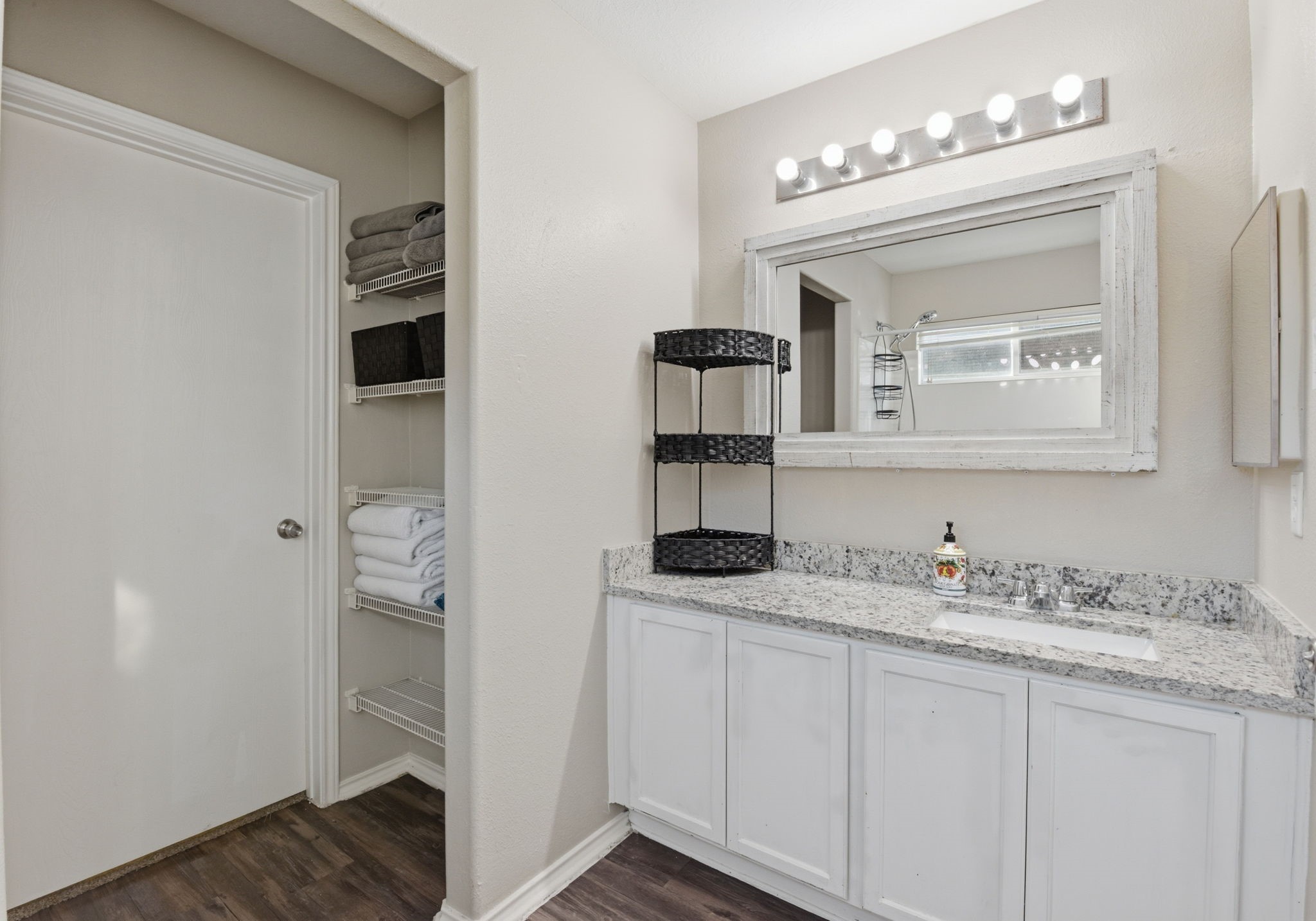 9519 Maple Green Lane Houston, TX 77044 - Photo 25 of 50 a bathroom with a sink and a mirror