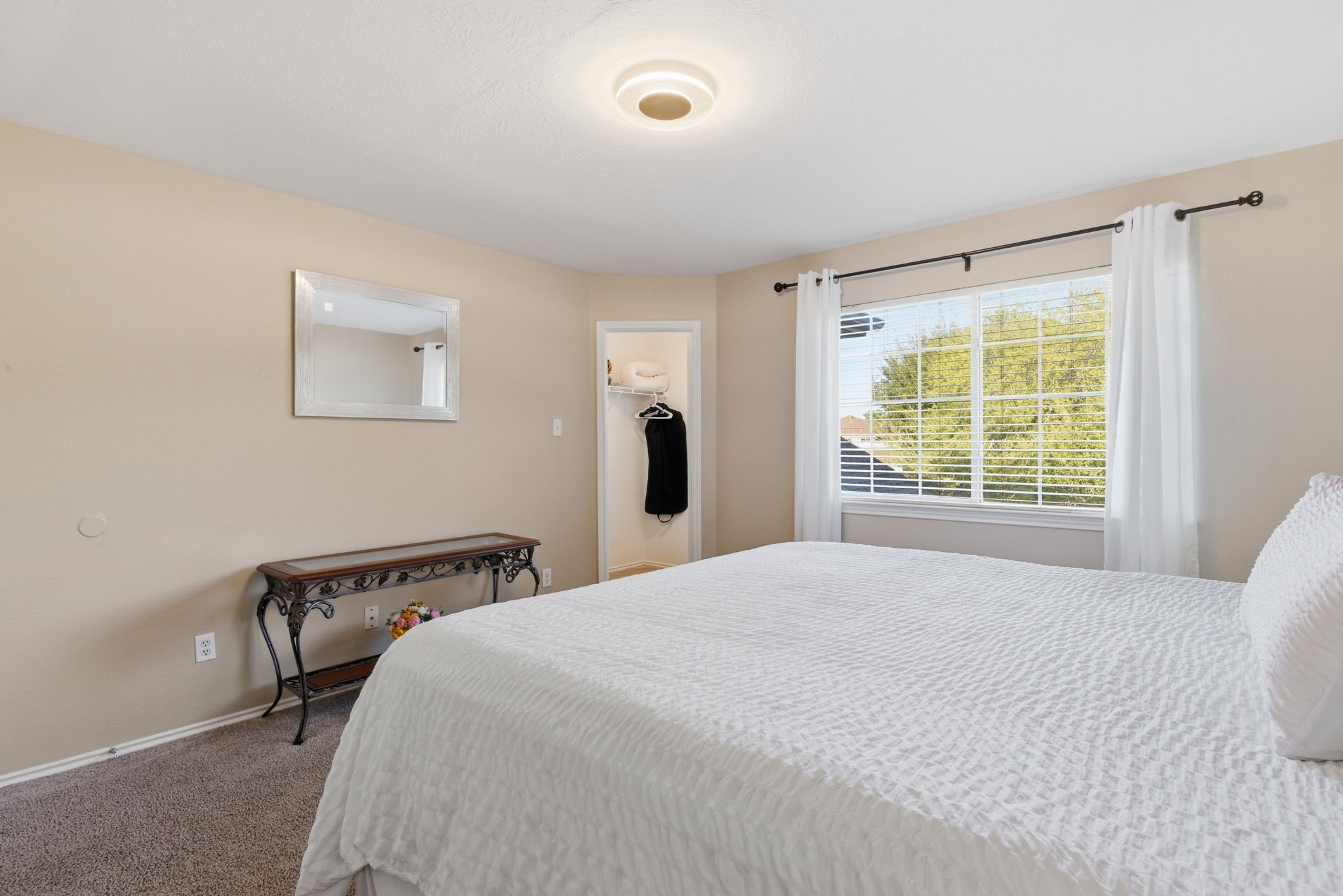 9519 Maple Green Lane Houston, TX 77044 - Photo 28 of 50 a bedroom with a bed and a window