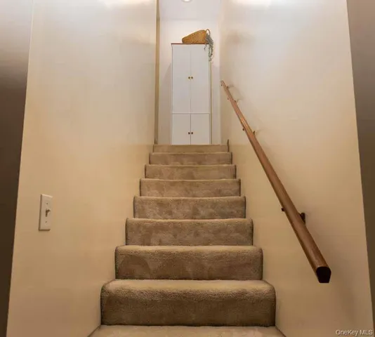 a view of entryway with stairs